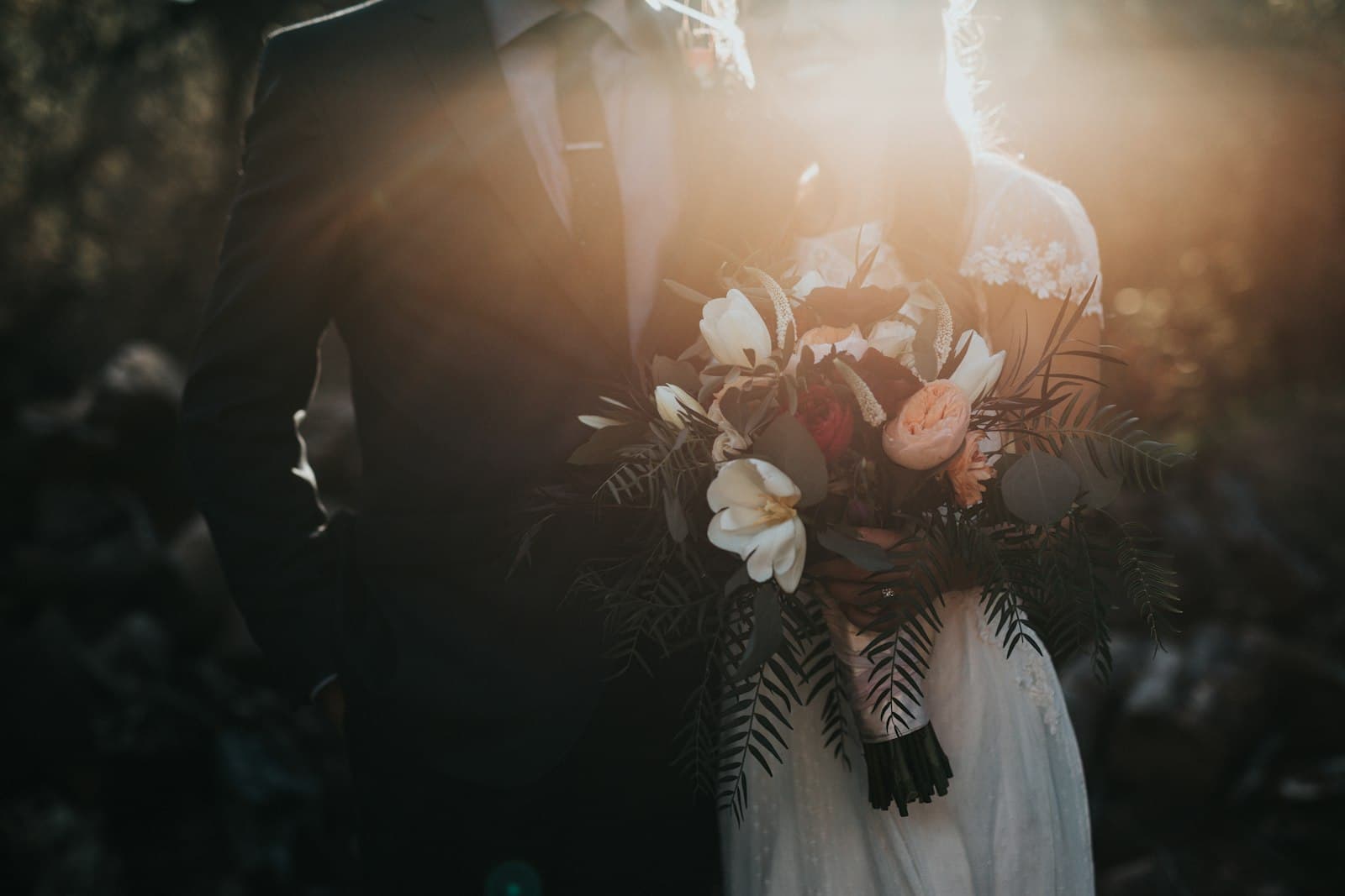 Bride and groom embracing during golden hour