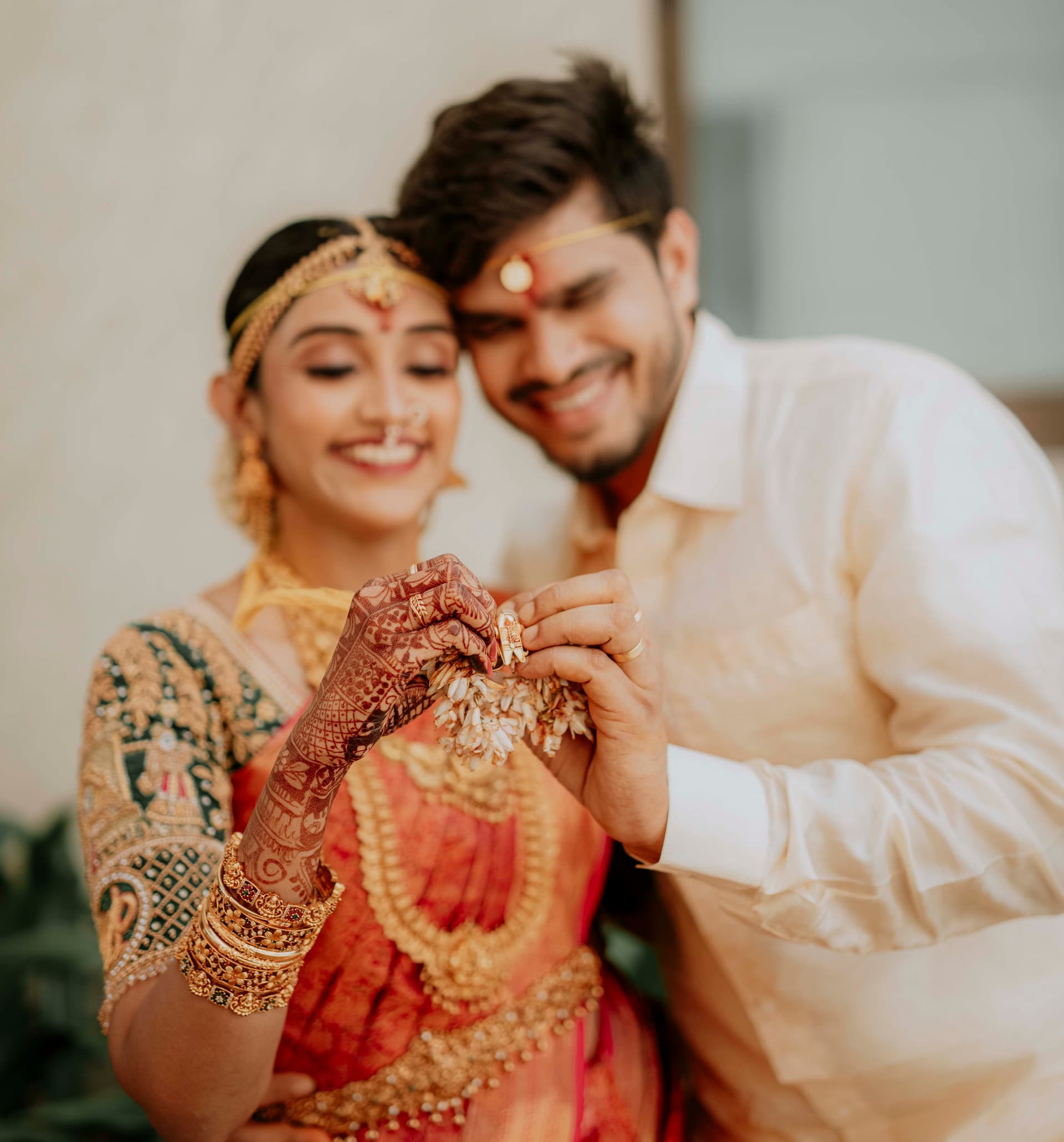 Bride and groom embracing during golden hour